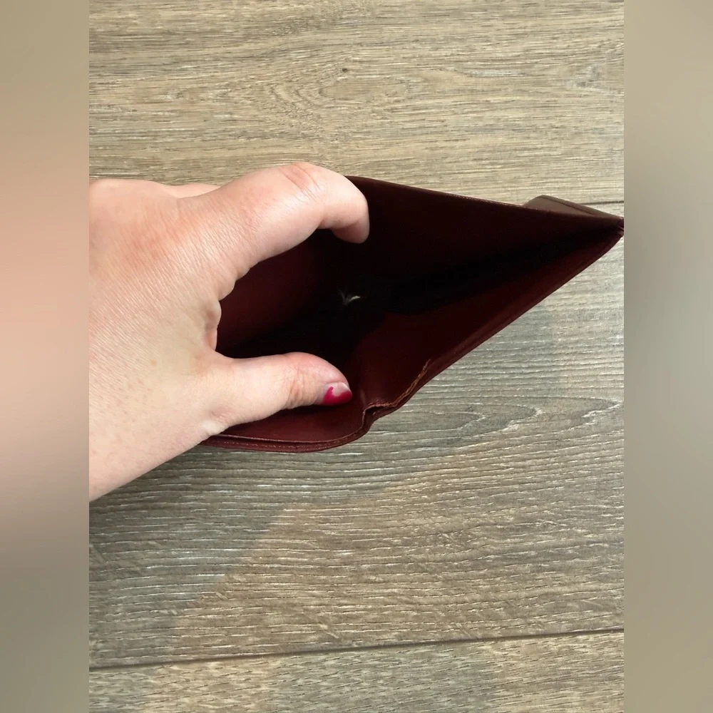 Cartier Men’s Deep Red Leather Bifold with Gold Corners